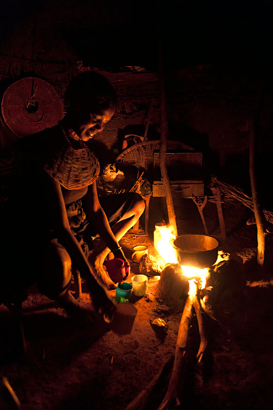  Pokot woman preparing tea for her family   Kenya